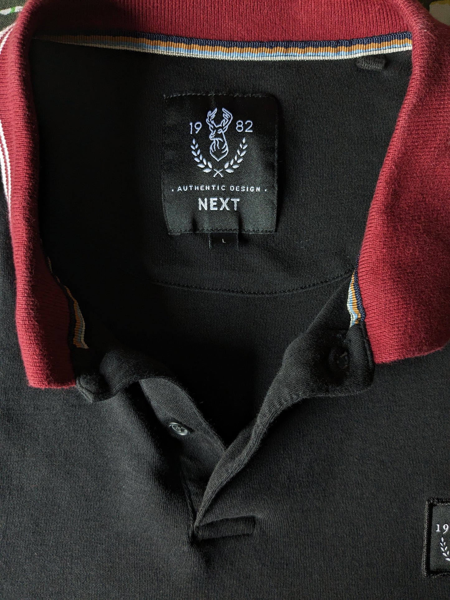 Pull polo NEXT. Couleur Noir Bordeaux Blanc. Taille L.