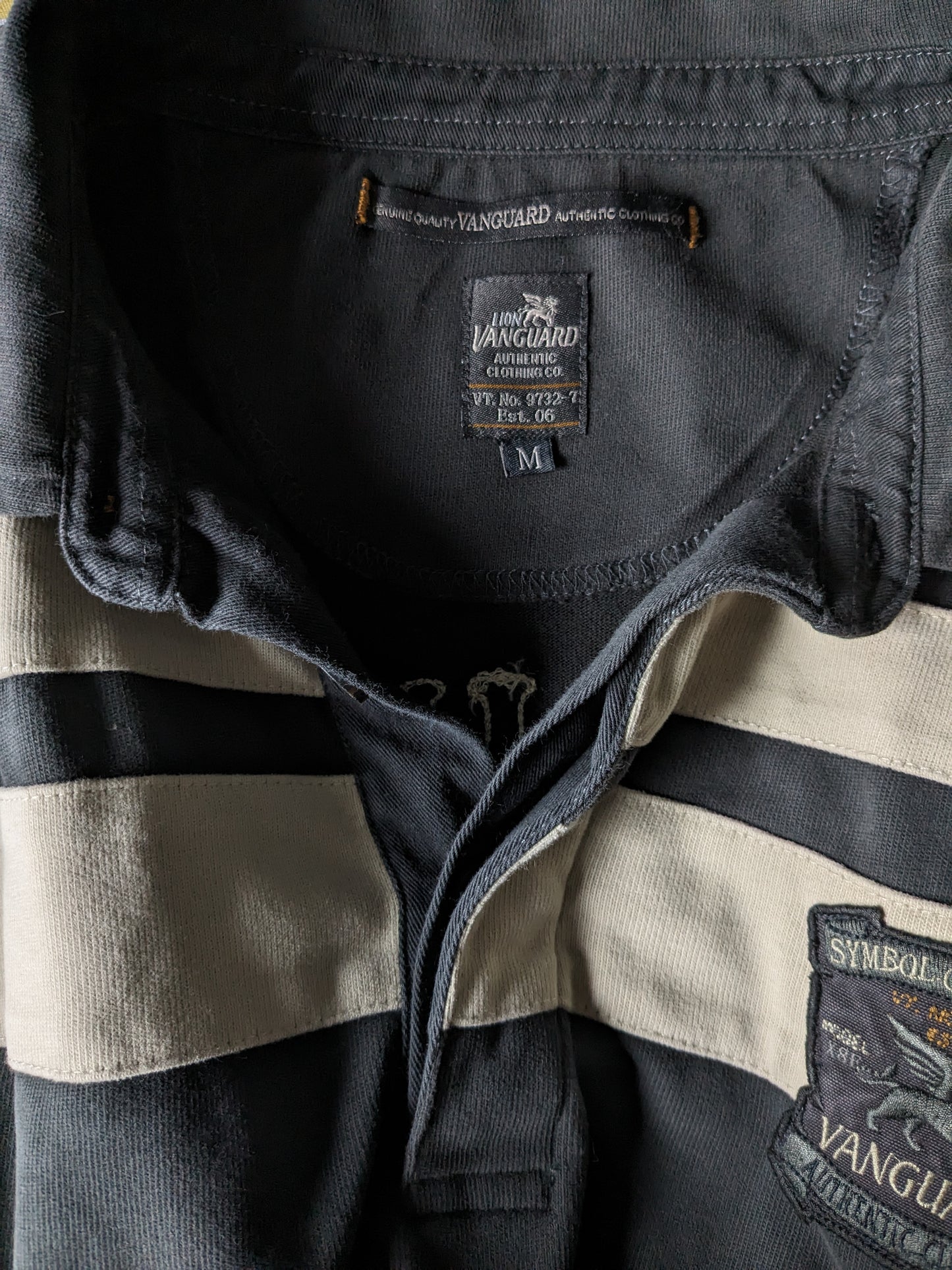 Vanguard polotrui. Grijs beige gekleurd. Maat M.