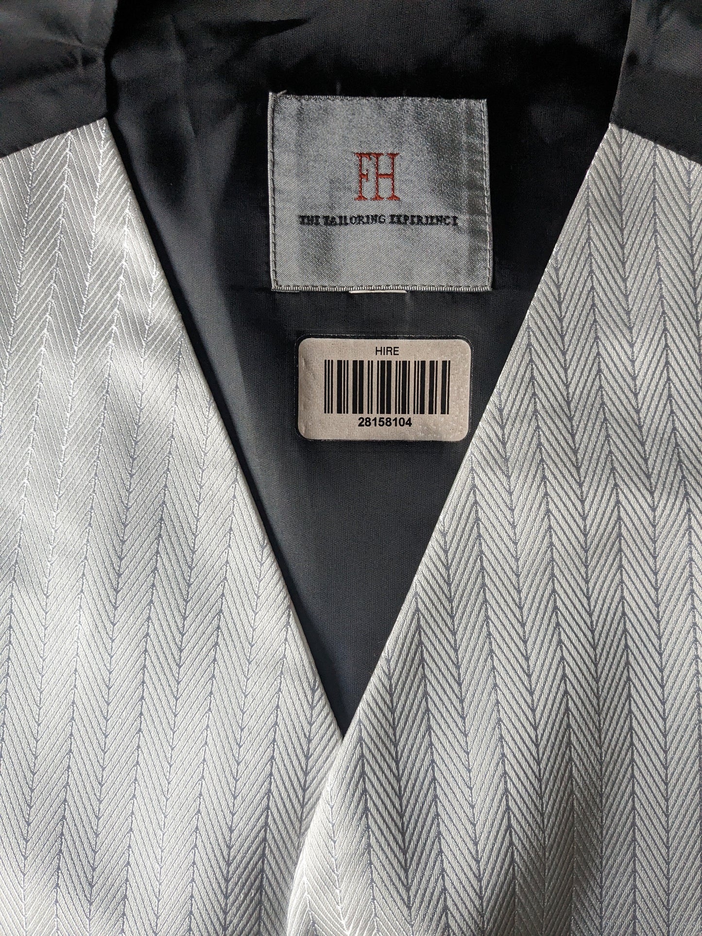 Gilet FH. Motif de couleur argent blanc. Taille S.