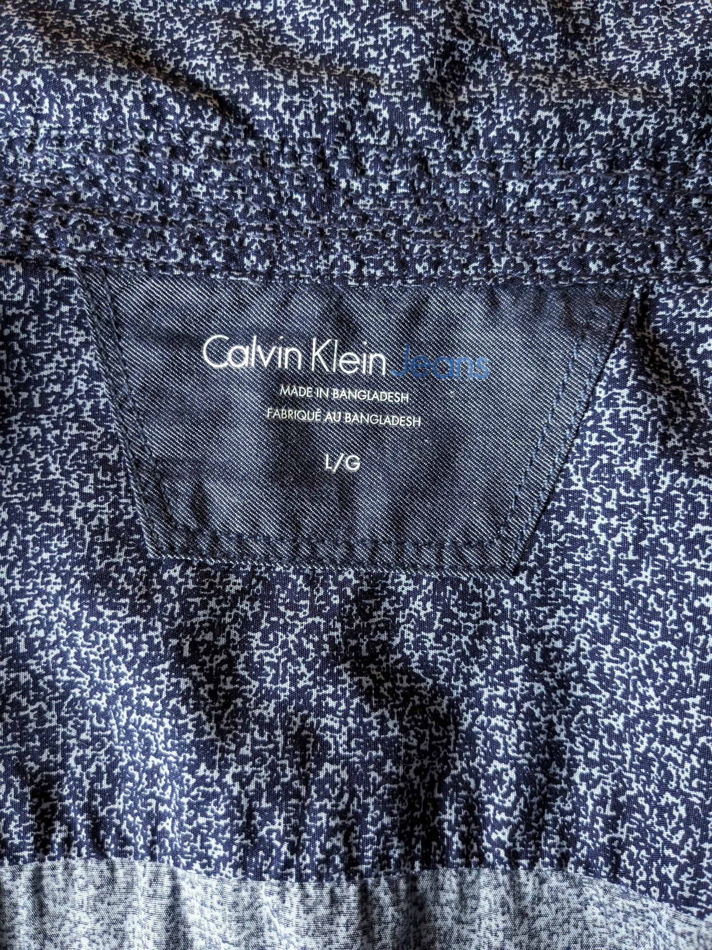 Chemise Calvin Klein. Impression bleue. Taille L.