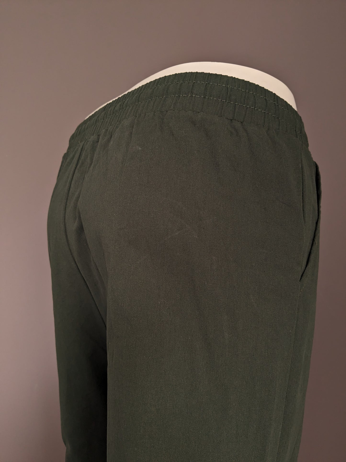 Brandless casual pants with elastic band. Colored green. Size