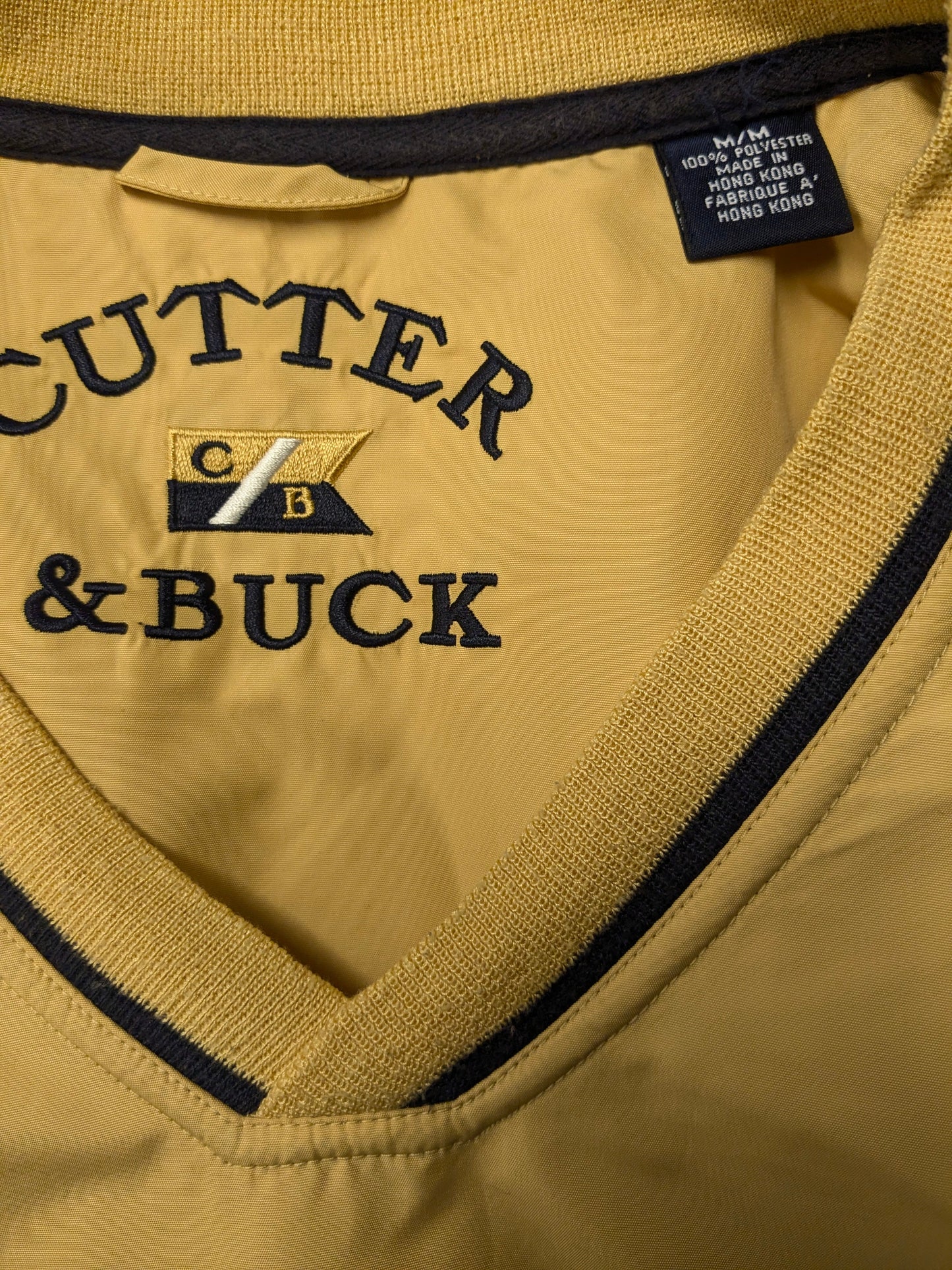 Cutter & Buck Spencer. Jaune de couleur ocre. Taille M / L.