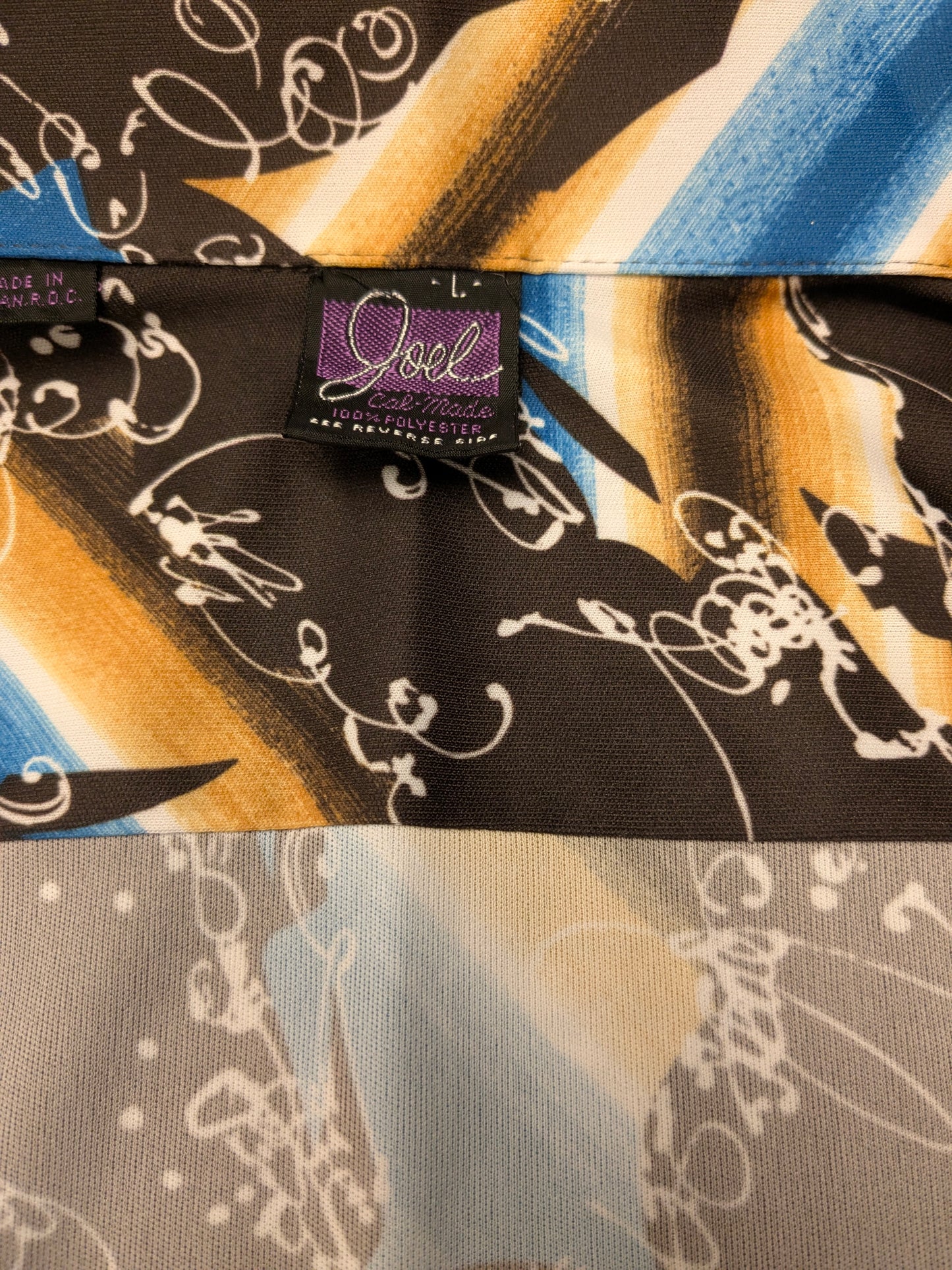 Vintage 70's Joel shirt with point collar. Brown blue white print. Size L. Stretch.