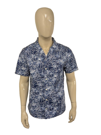 Manche courte de la chemise nautica. Impression blanche bleue. Taille L.