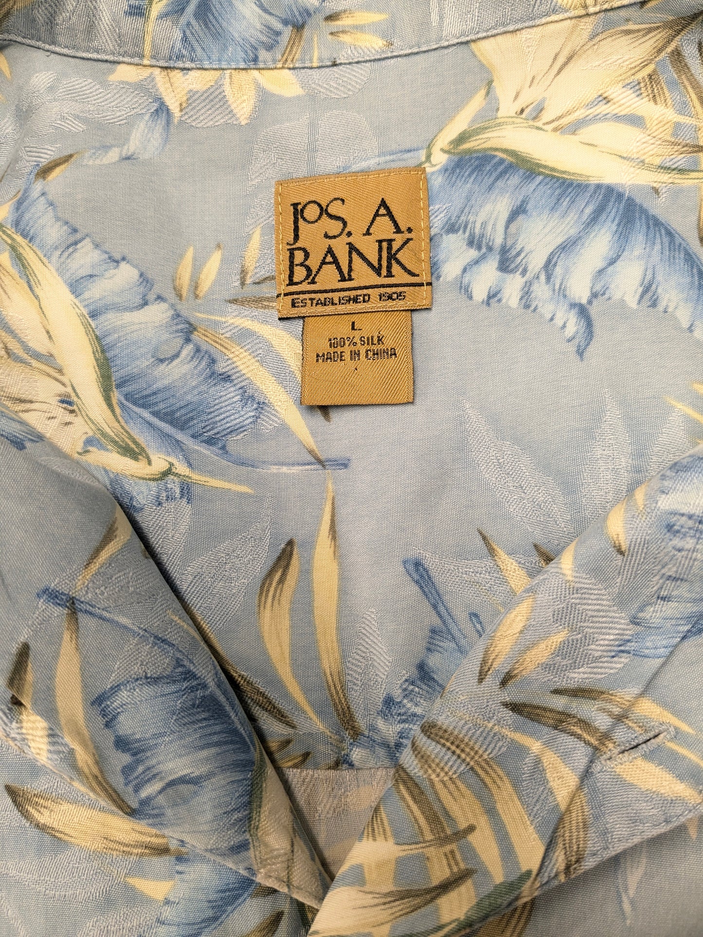 Sleeve corta di Jos A. Bank Silk. Blue Beige Green Flowers Stampa. Taglia L / XL. Silk al 100%.