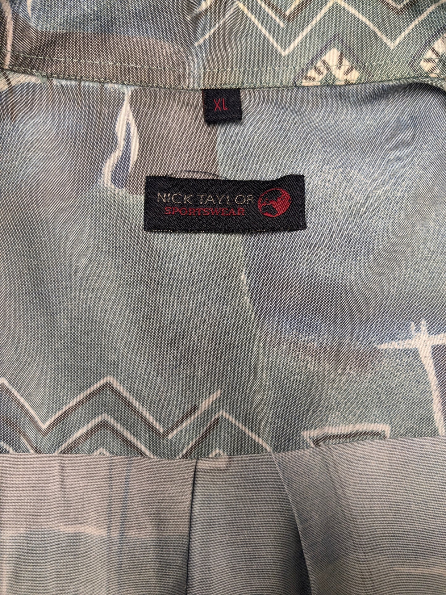 Shirt Nick Taylor des années 80-90 vintage. Impression gris vert bleu. Taille xl.