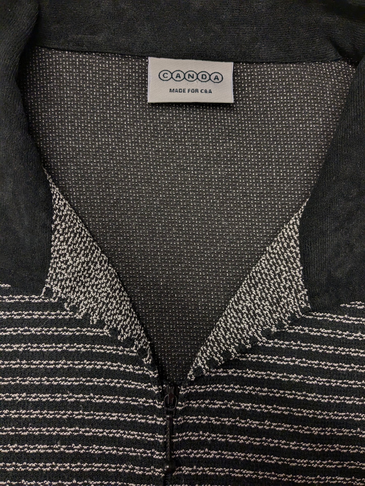 Vintage Canda cardigan with zipper. Black and white colored. Size XL.