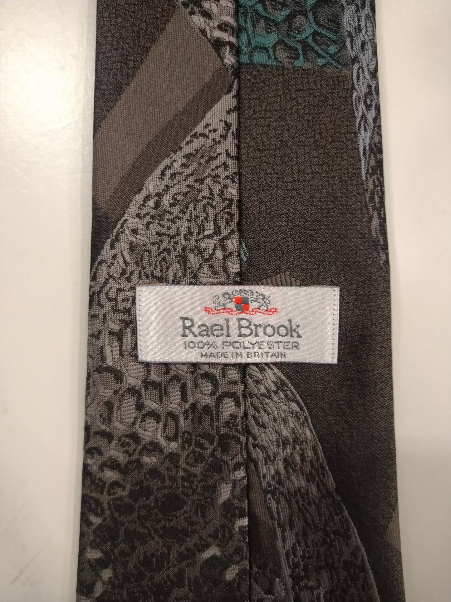 Rael Brook Polyester tie. Gray brown green silver shiny motif.