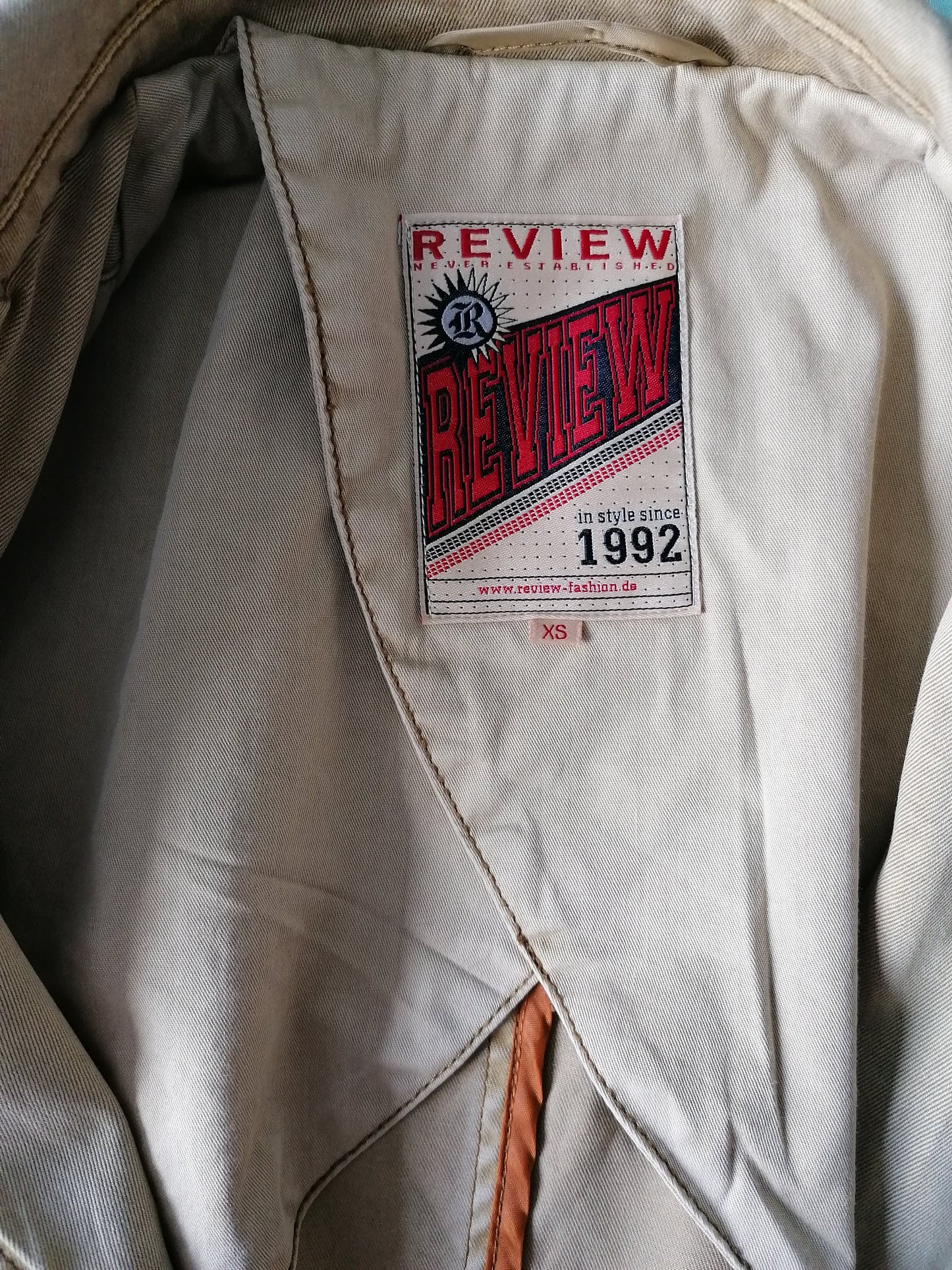 Review jacket. Light brown colored. Size XS