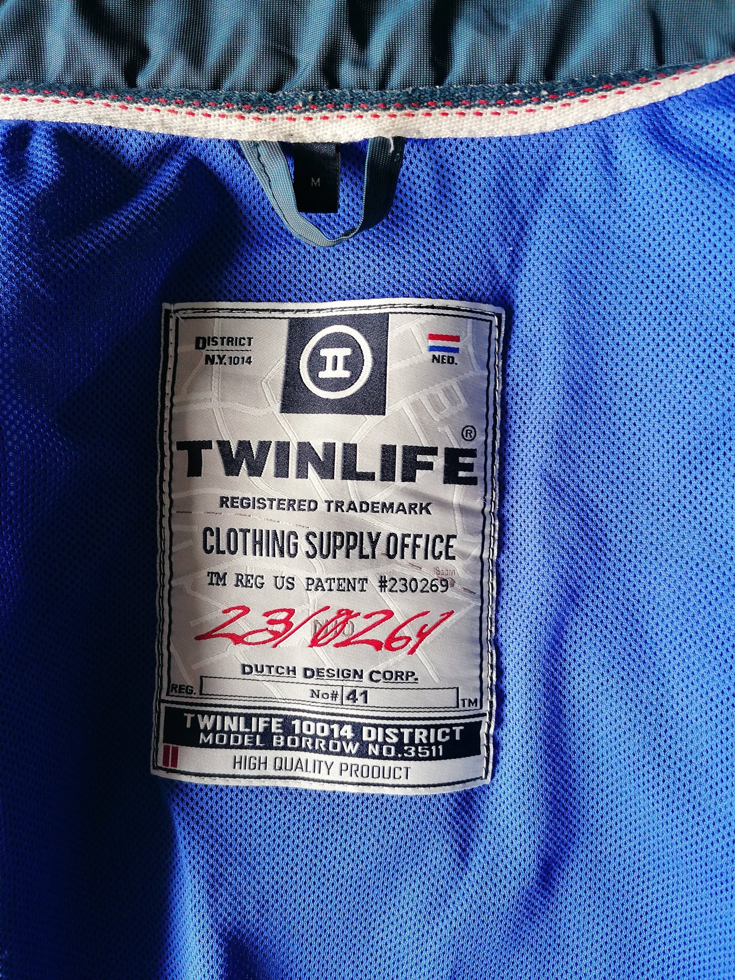 TwinLife tra Giacca. Glow blu verdastro. Taglia M.