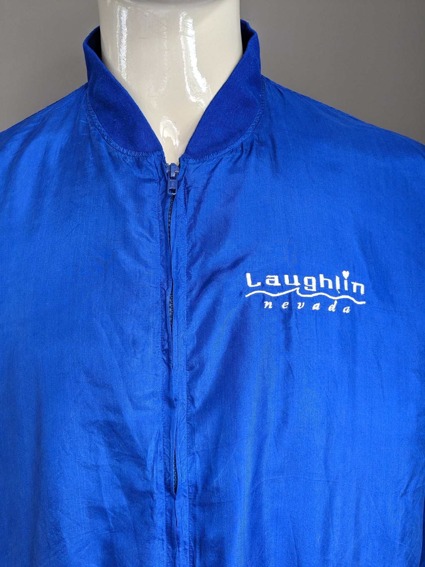 Vintage 80's-90's Active Zijden Pure sport jack. "Laughlin Nevada". Blauw gekleurd. Maat L / XL.