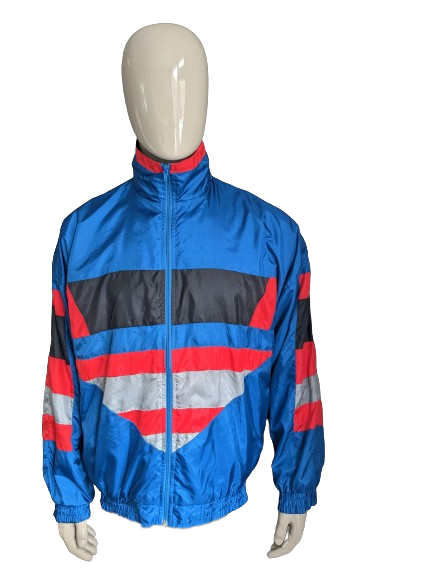 Sport Jack des années 80-90. Bleu rouge noir gris coloré. Taille l / xl.