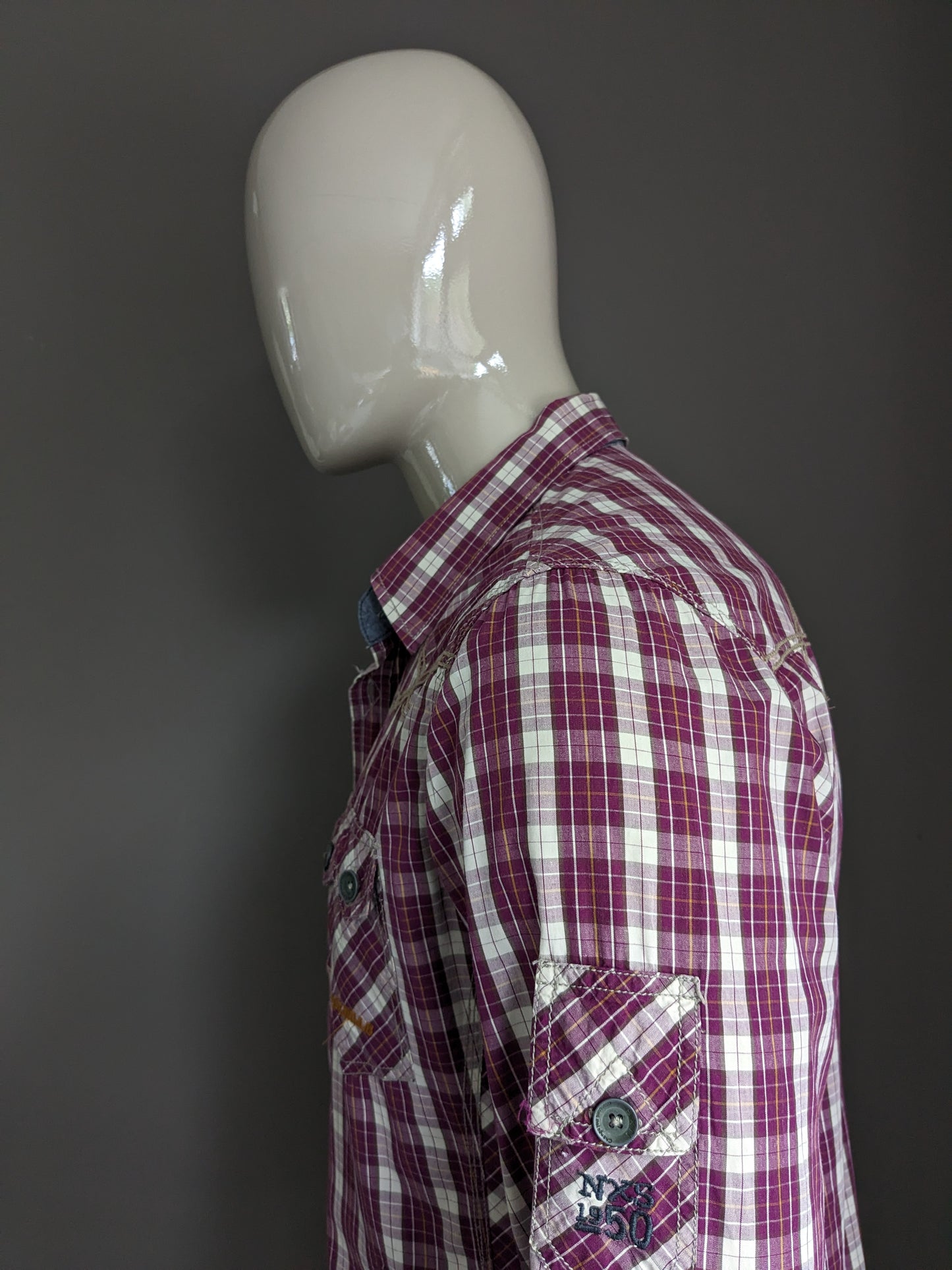 No excess shirt. Purple brown yellow checked with applications. Size L.