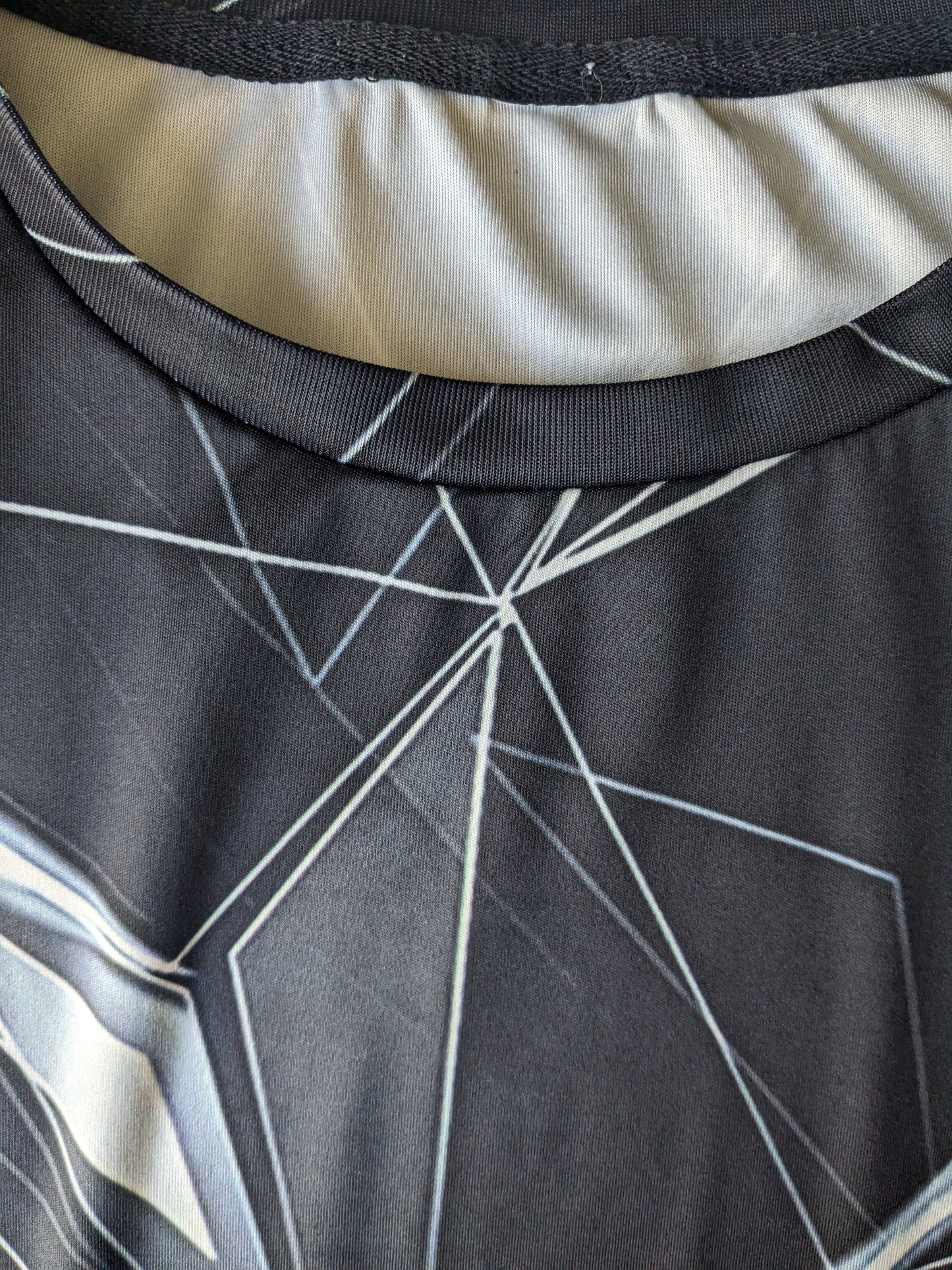 Geometric Print shirt. Black white colored. Size M. Stretch.