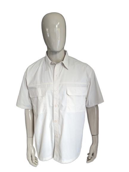 Le Coq Sportif shirt short sleeve. Beige colored. Size XL.
