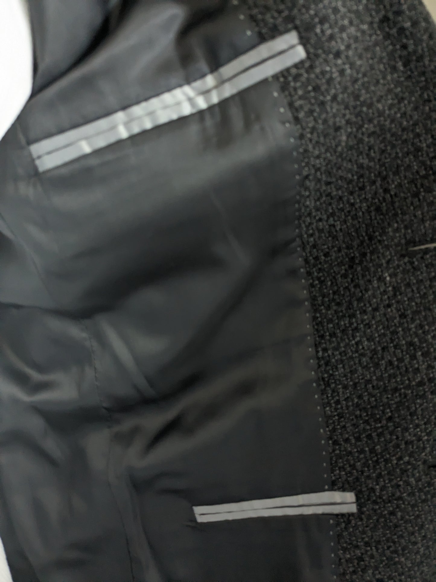 Giacca di lana Calvin Klein CK. Motivo misto nero grigio. Dimensione 50 / M. Slim Fit Line.