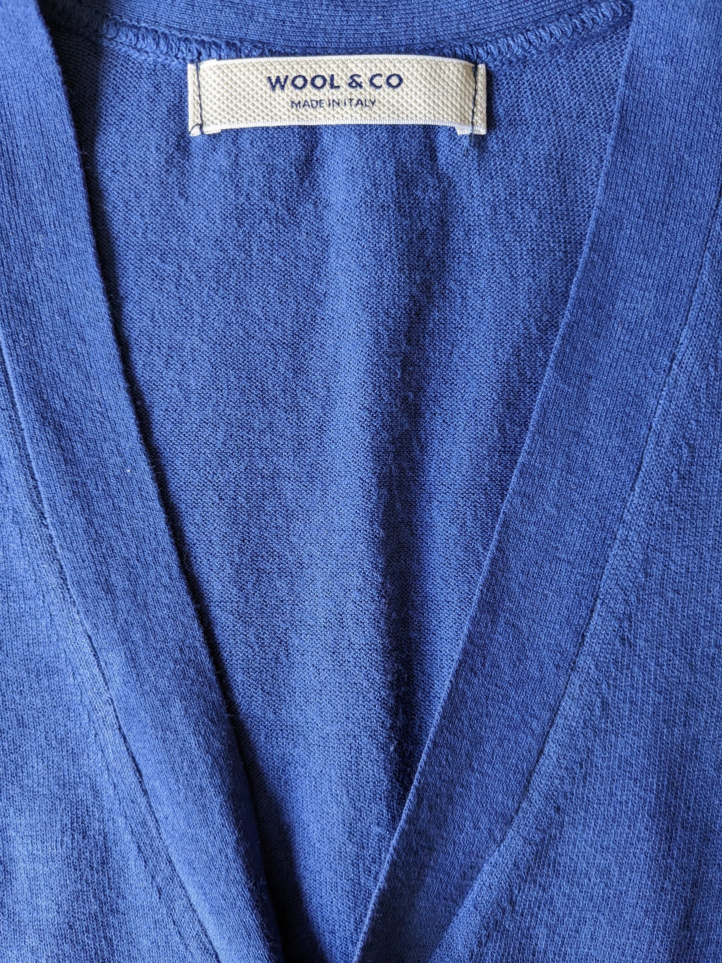Gilet de coton en laine et en co. Couleur bleue. Taille S.