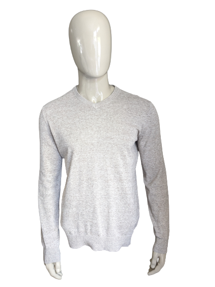 H&M-Pullover mit V-Ausschnitt. Beigebraun gemischt. Größe M.