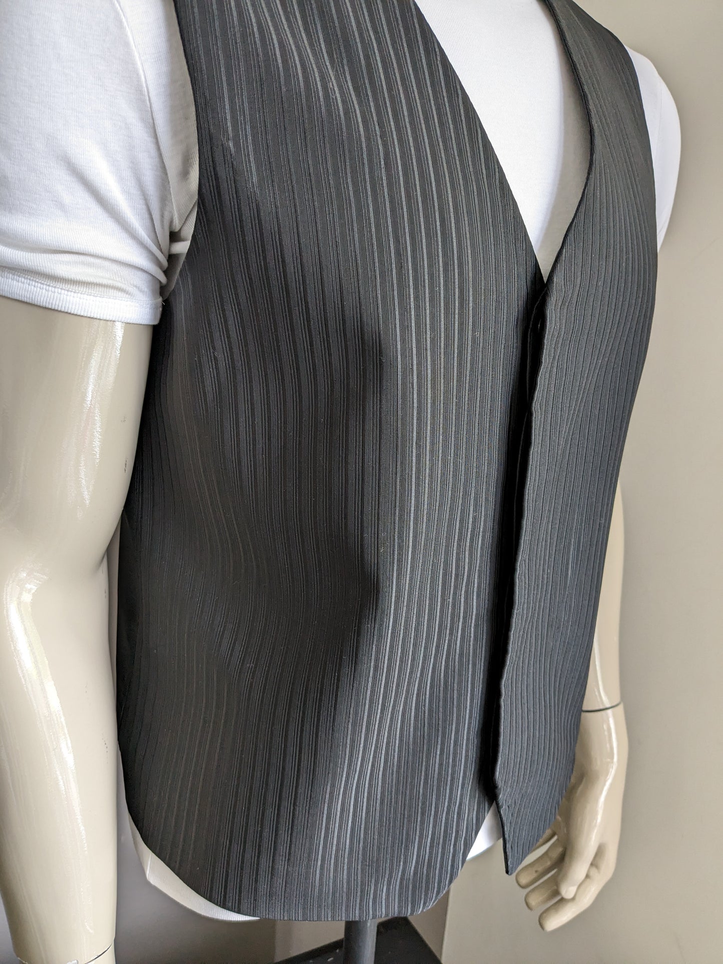 Woolen waistcoat with hidden knots. Black shiny striped. Size M / L.