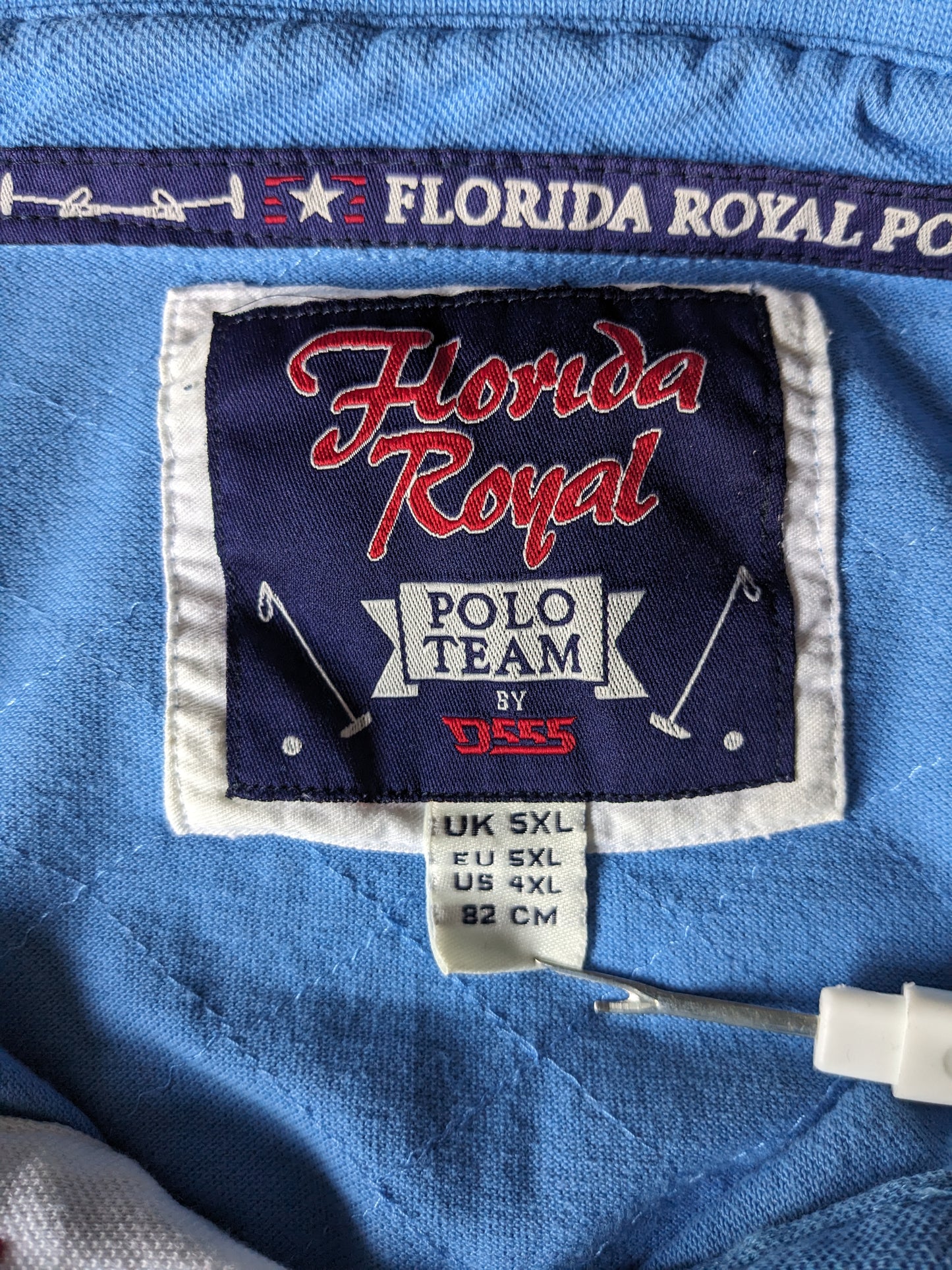 Florida Royal polo. Blauw met geborduurde applicaties. Maat 5XL / XXXXXL.