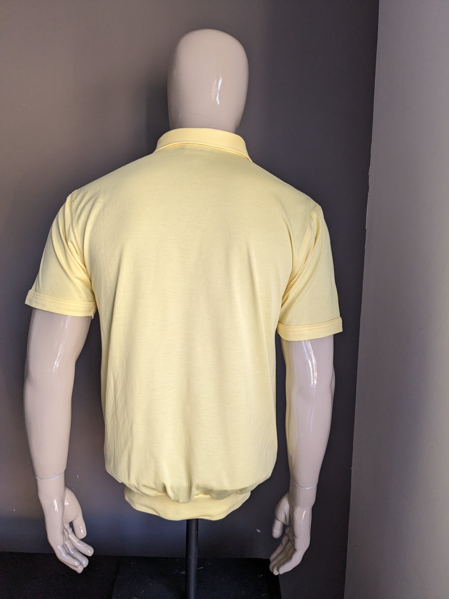 Vintage Canda Polo with elastic band. Yellow colored. Size M.