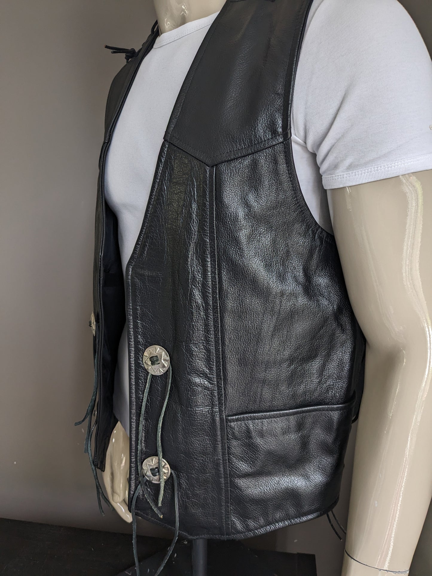 Tough master's leather leather biker waistcoat. Double-sided with lace & spas applications. Black colored. Size 2XL.