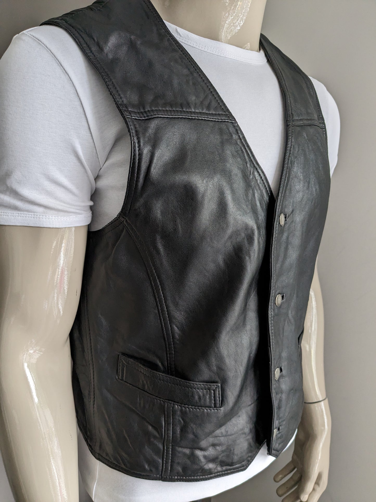 Vintage leather waistcoat with press studs. Double -sided leather. Black colored. Size M. #316.