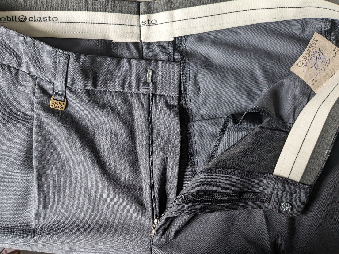 Mobil elasto pantalones con cubierta. Motivo gris oscuro. Tamaño 52 / L.