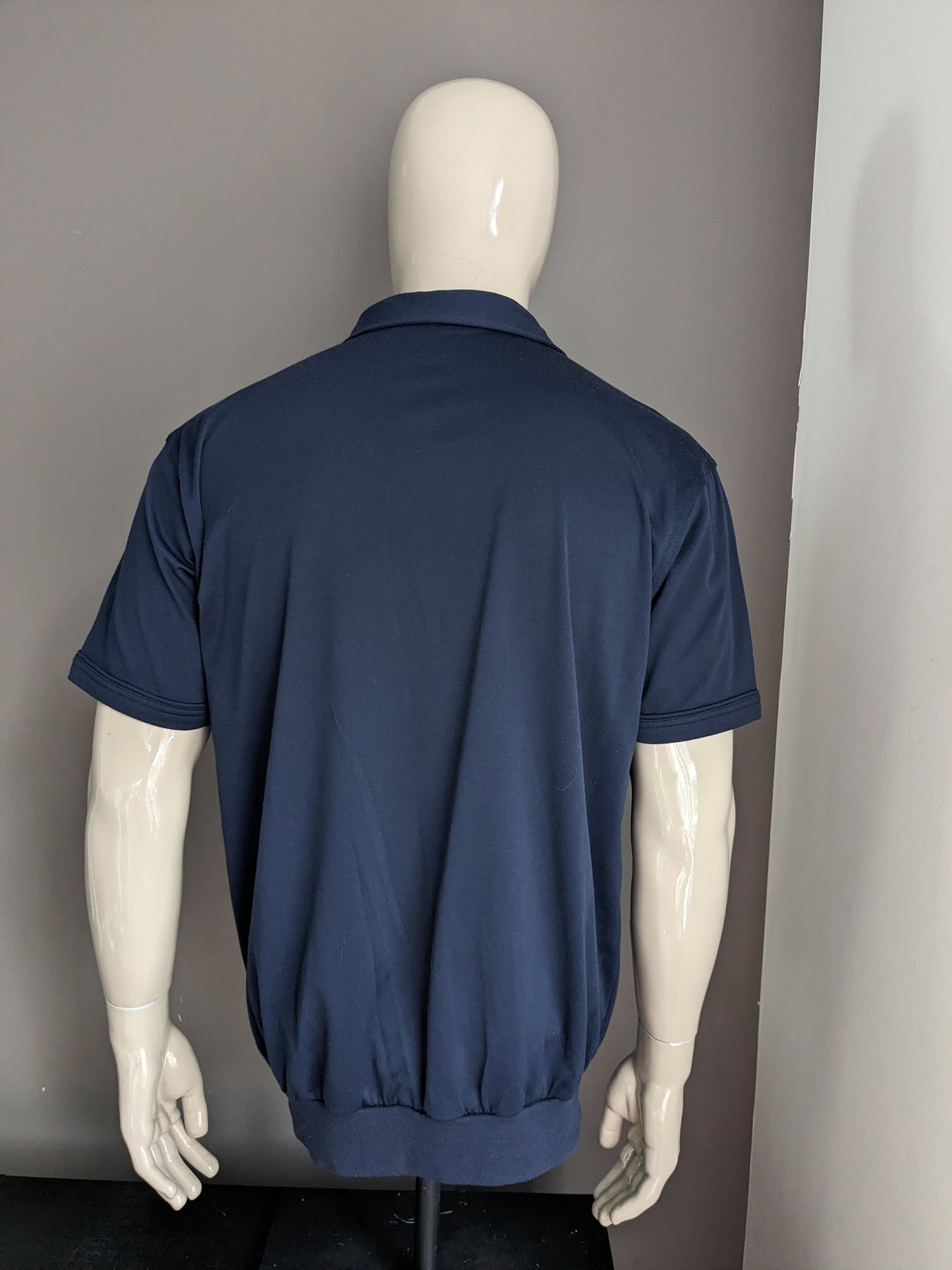 Vintage Canda Polo with elastic band. Dark blue colored. Size XL.