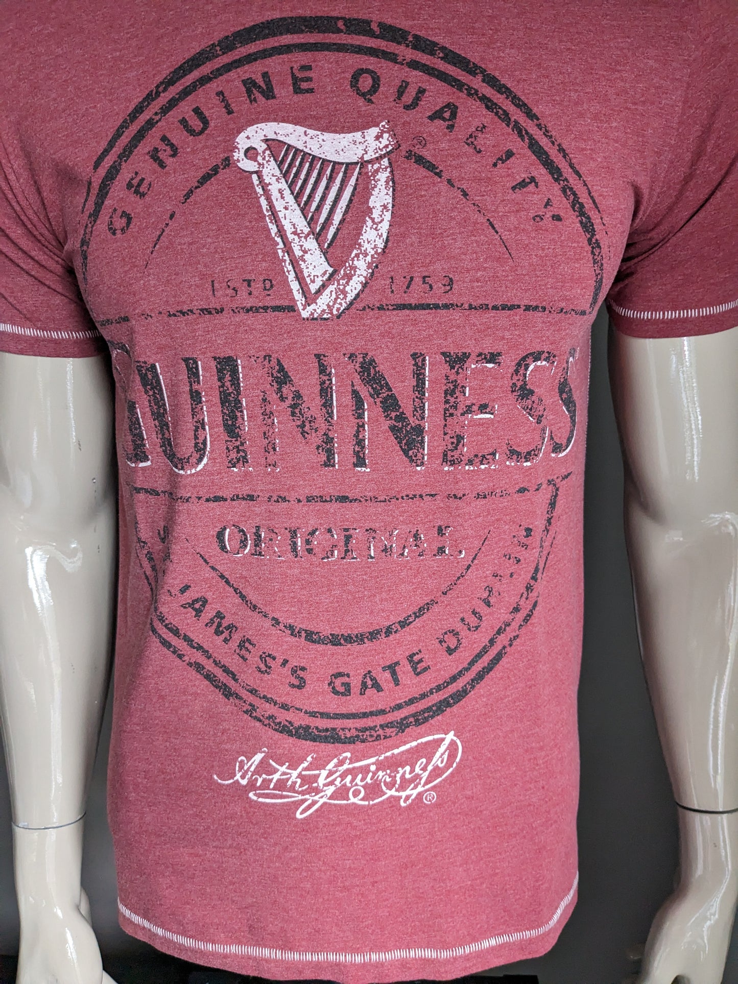 Guinness shirt. Red mixed with print. Size M.