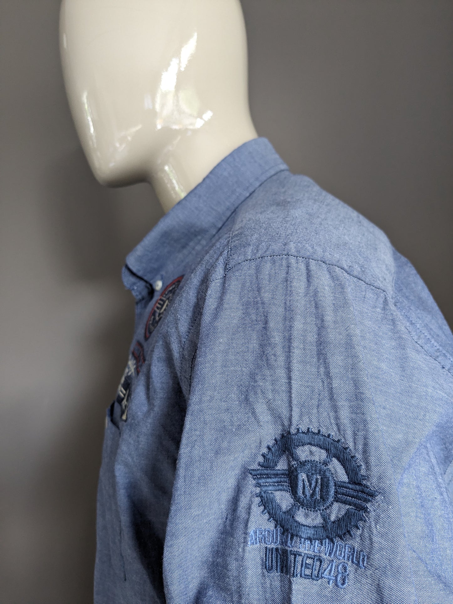 Tailor & Son overhemd. Blauw gemêleerd met applicaties. Maat 2XL / XXL.