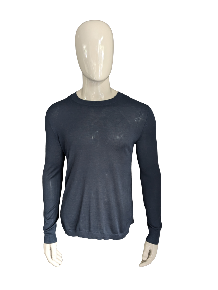 Pull fin Emporio Armani. De couleur bleu noir. Taille S.