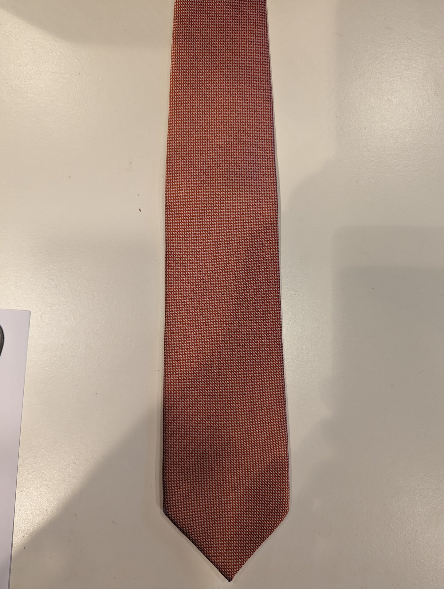 Cravatta di seta di Michaelis. Motivo arancione bianco.
