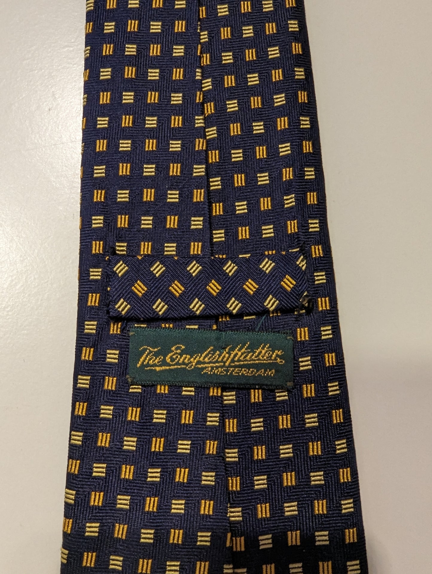 The English Hatter zijde stropdas. Blauw geel motief.