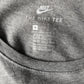 Nike "The Nike Tee" shirt. Grijs met opdruk. Maat M.