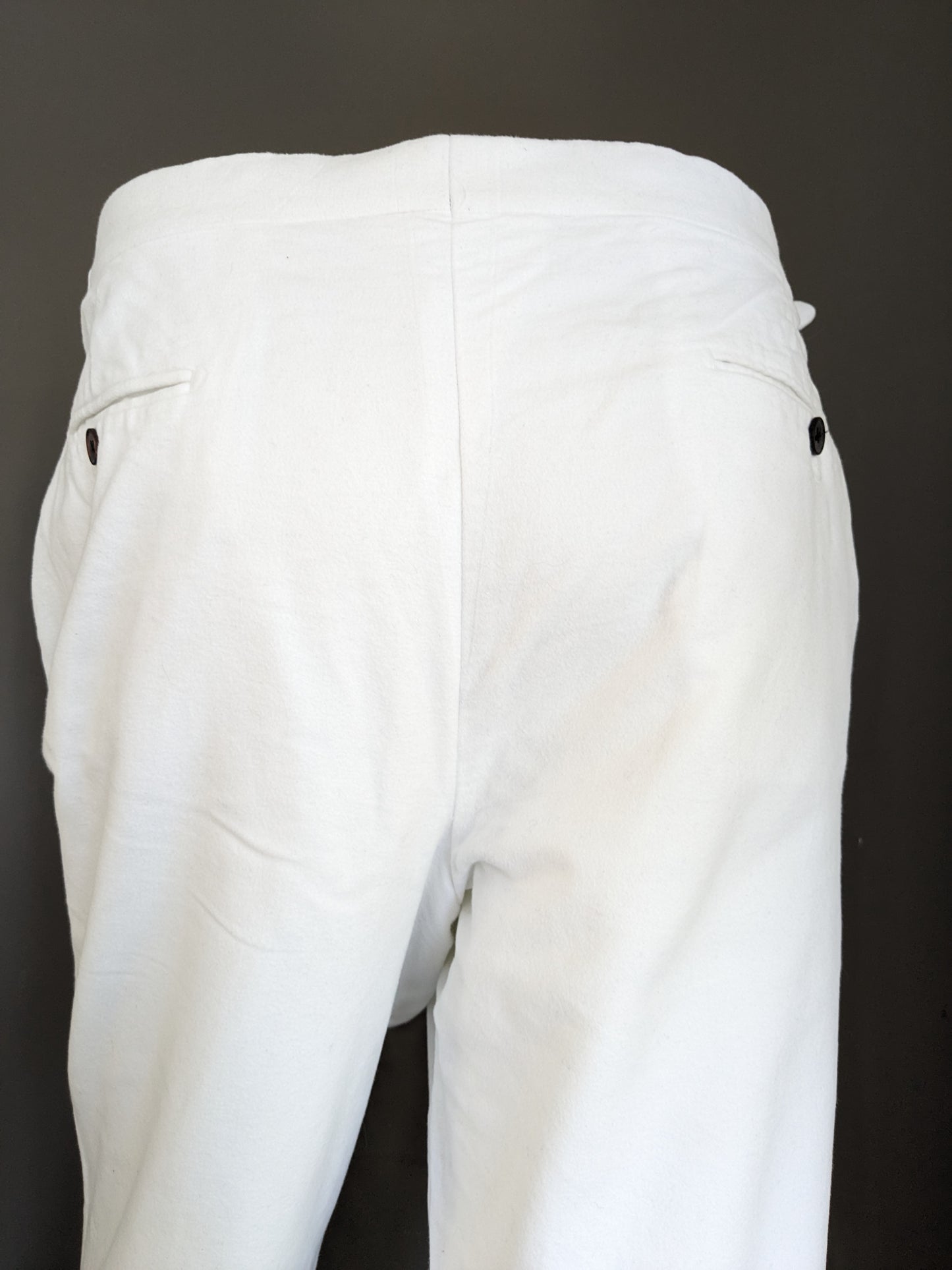 Pantaloni con risvolto di Suit Supply e applicazioni su reggicalze. Di colore bianco. Taglia 27 (54/L)