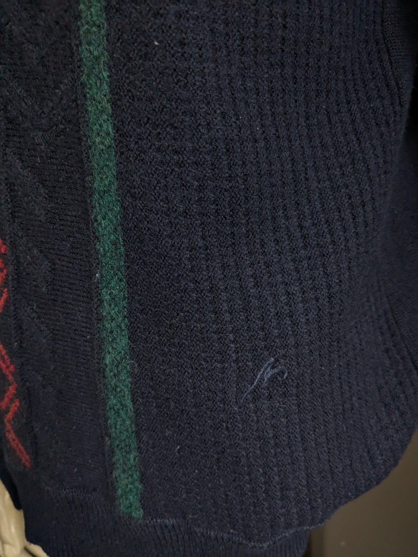 Vintage Maselli Wolle-Pullover mit V-Ausschnitt. Dunkelblau mit gelb rotgrün blauem Motiv. Größe L.