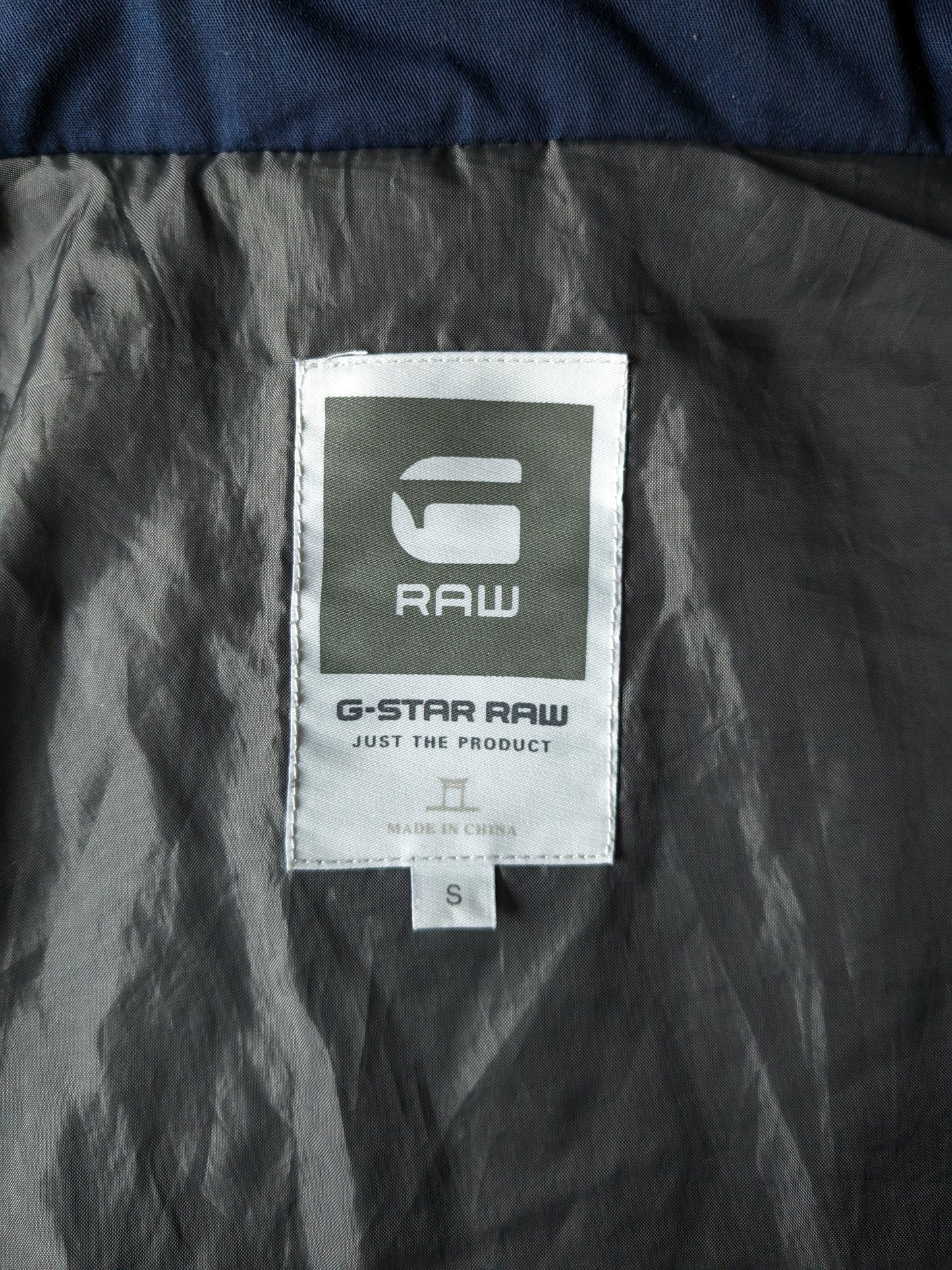 G-Star raw light weight quilted jacket with hidden hood. Dark blue colored. Size S.