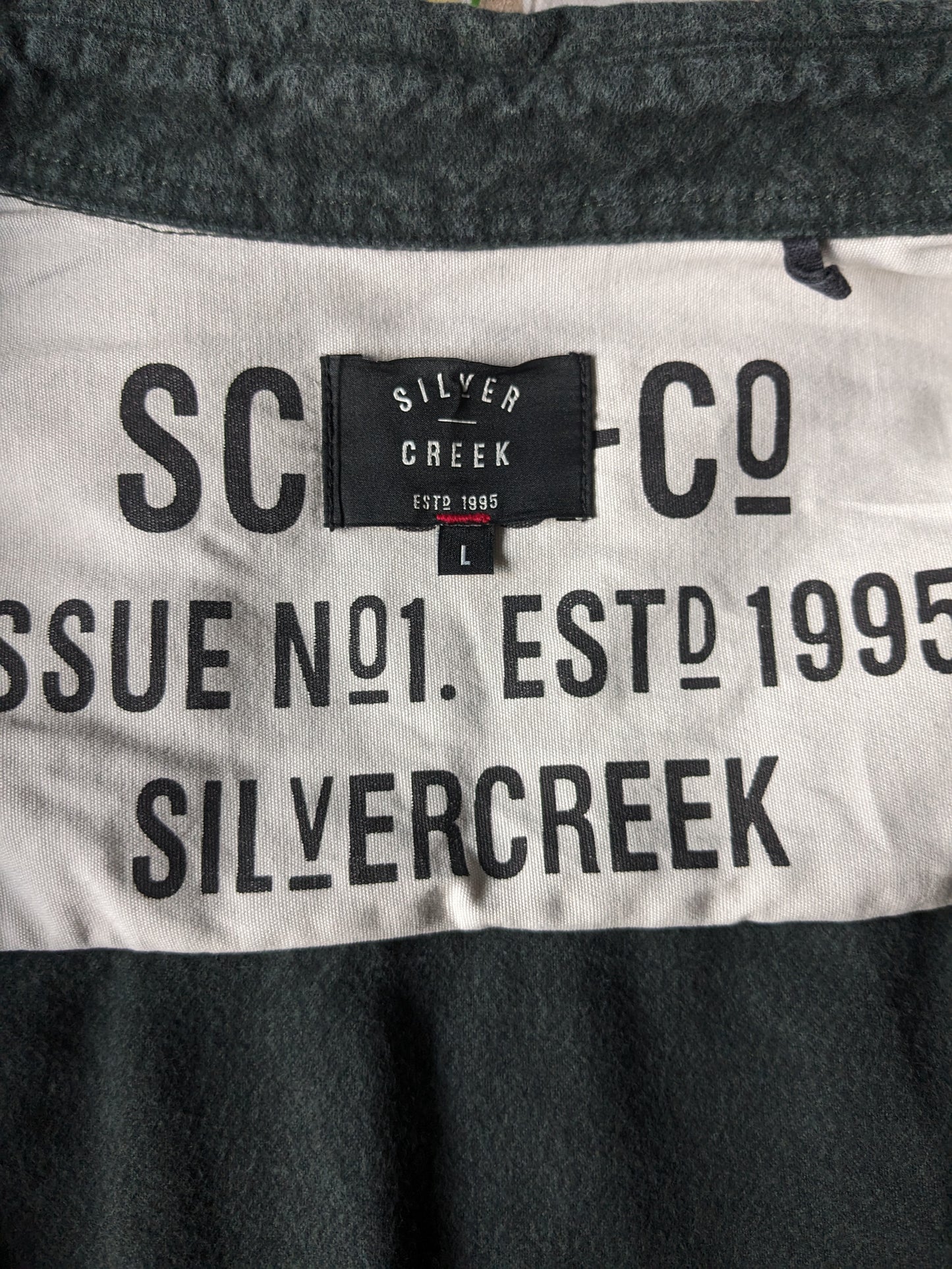 SilverCreek shirt. Dark green, somewhat thicker fabric. Size L.