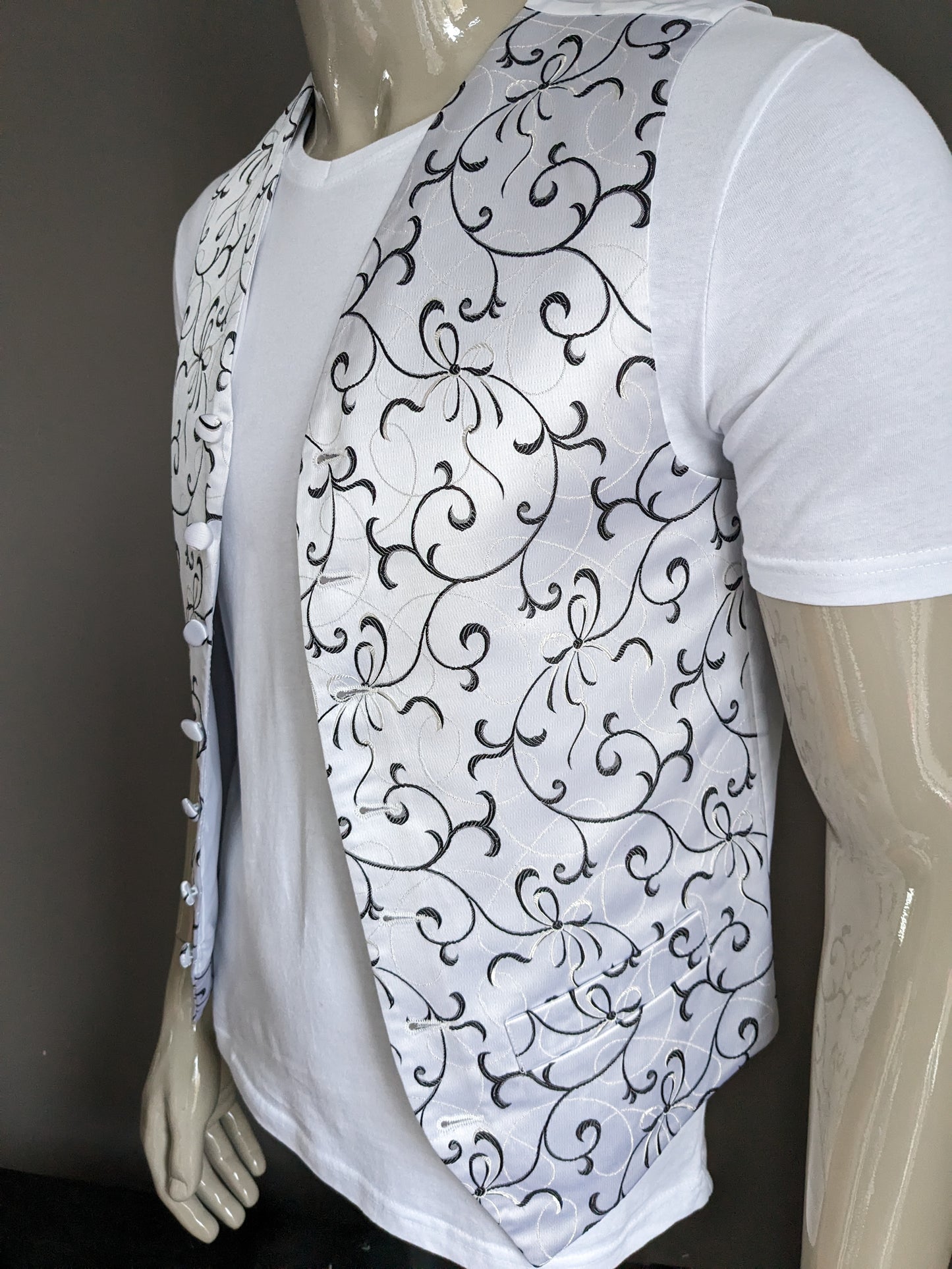 FH waistcoat. Light lilac colored with white black motif. Size M.