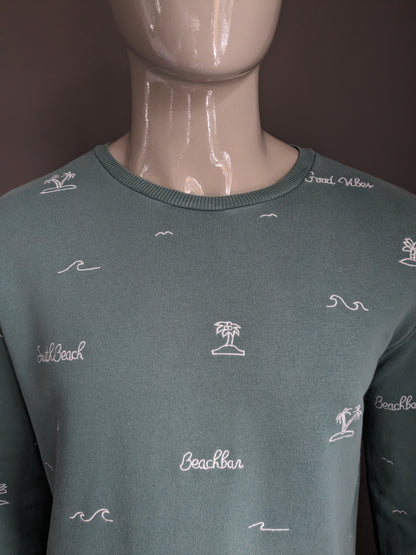 Cultivez le pull. De couleur blanc vert. Taille L.