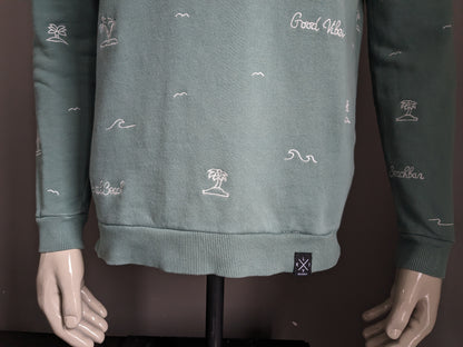 Cultivez le pull. De couleur blanc vert. Taille L.