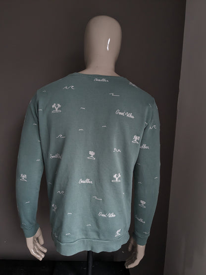 Cultivez le pull. De couleur blanc vert. Taille L.