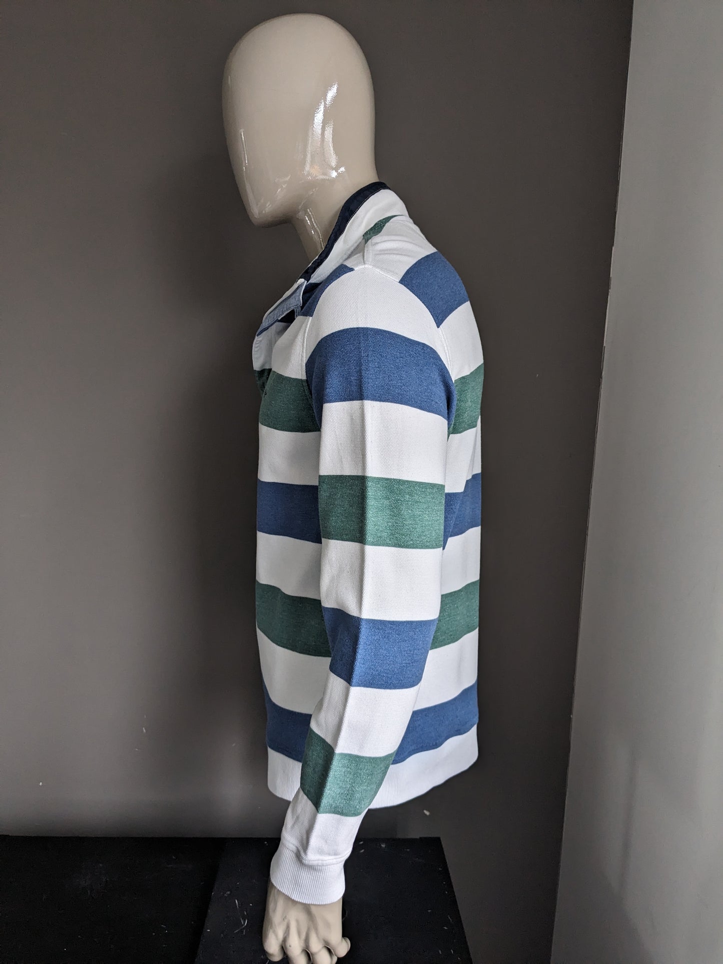 Pull Baileys avec fermeture éclair. Rayé bleu vert blanc. Taille XL.