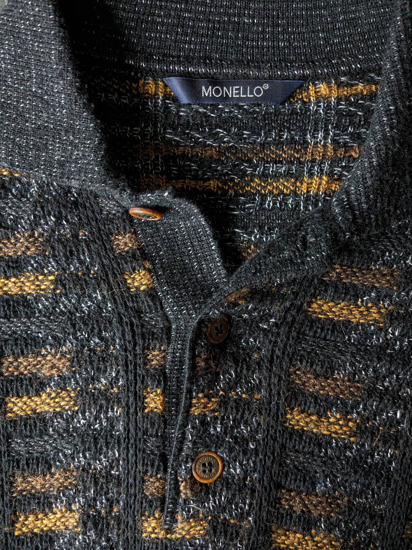 Suéter de polo de lana monello vintage. Color negro amarillo de color. Tamaño L. 55% de lana.