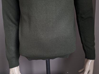 Pull de la Compagnie CSC avec fermeture éclair. De couleur vert foncé. Taille M.