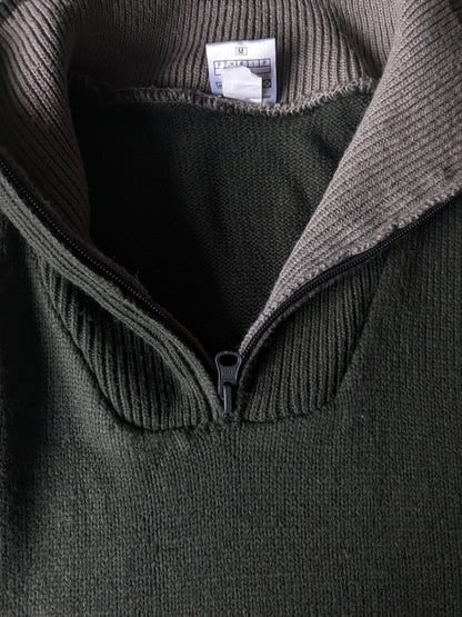 Pull de la Compagnie CSC avec fermeture éclair. De couleur vert foncé. Taille M.
