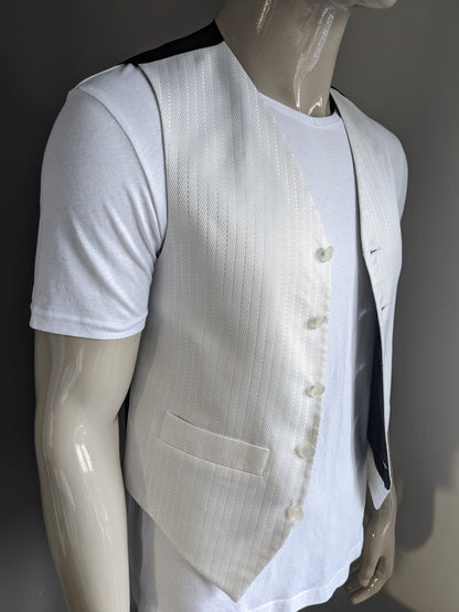 Gilet FH. Motif de couleur argent blanc. Taille S.