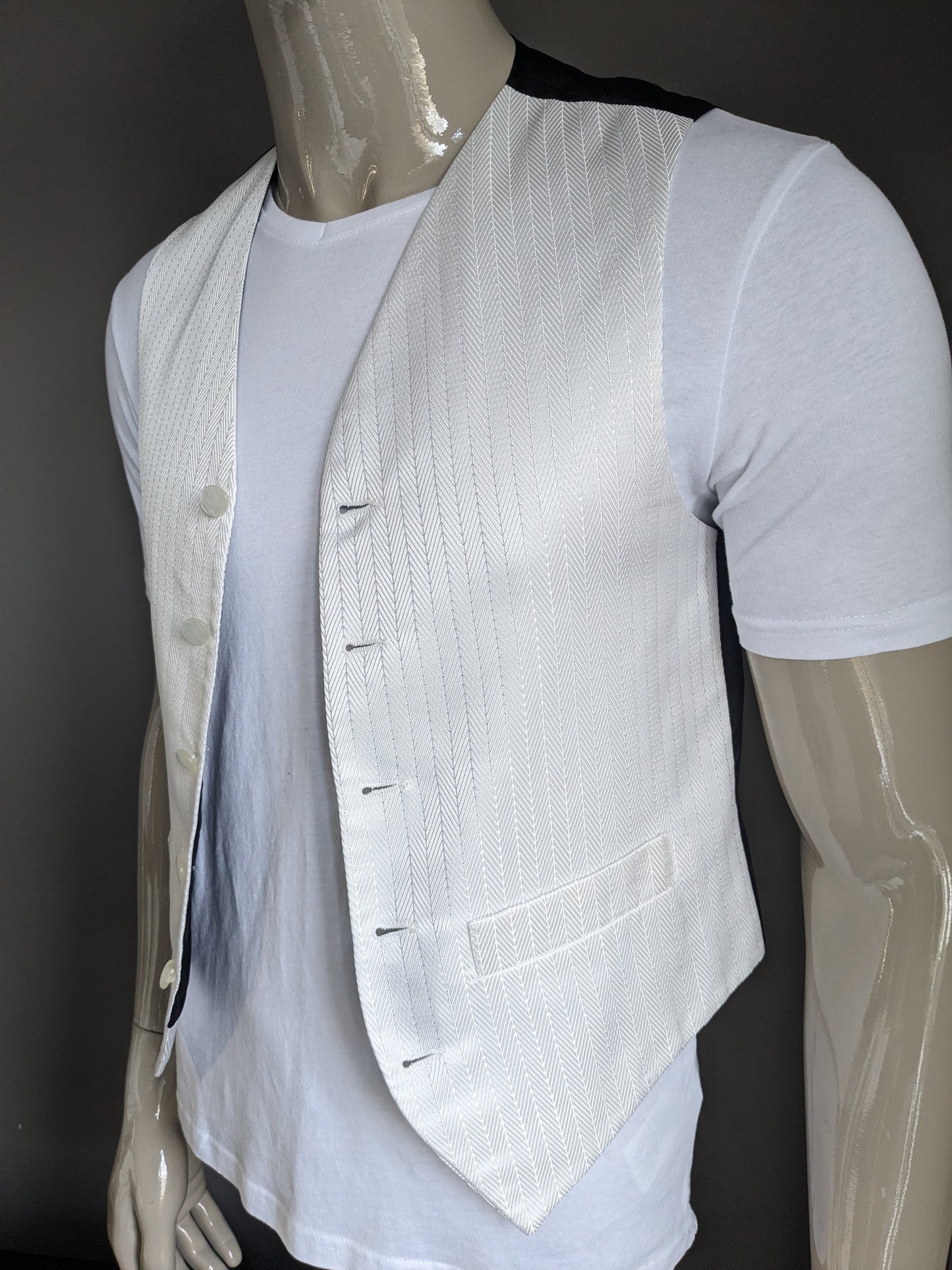 Gilet FH. Motif de couleur argent blanc. Taille S.