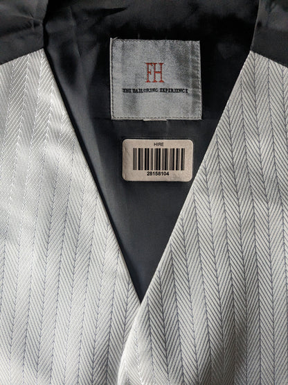 Gilet FH. Motif de couleur argent blanc. Taille S.